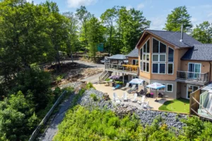 Aerial view of a Muskoka cottage property surrounded by forest and natural landscapes linked to Sterling Point filming locations